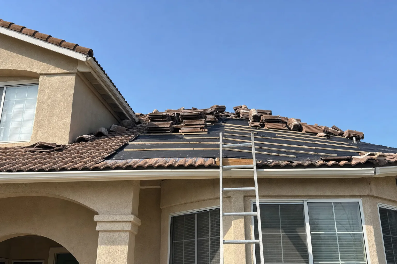 Tile roof repair in Murrieta, CA: new underlayment under concrete roof tiles